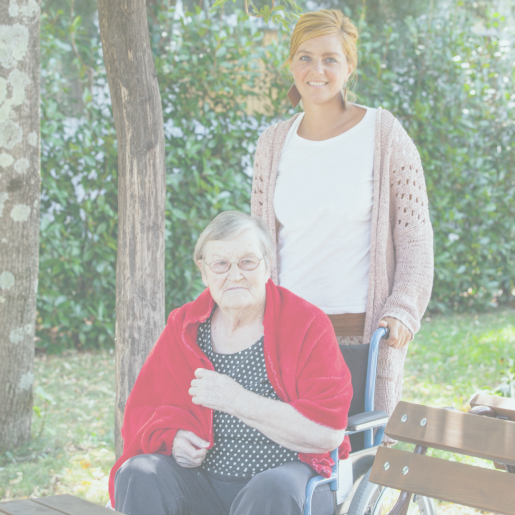 care giver assisting elderly lady in the park